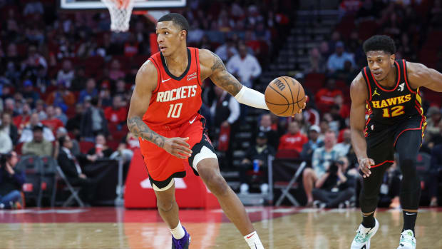 Rockets forward Jabari Smith Jr. dribbles the ball during the first quarter against the Atlanta Hawks at Toyota Center.